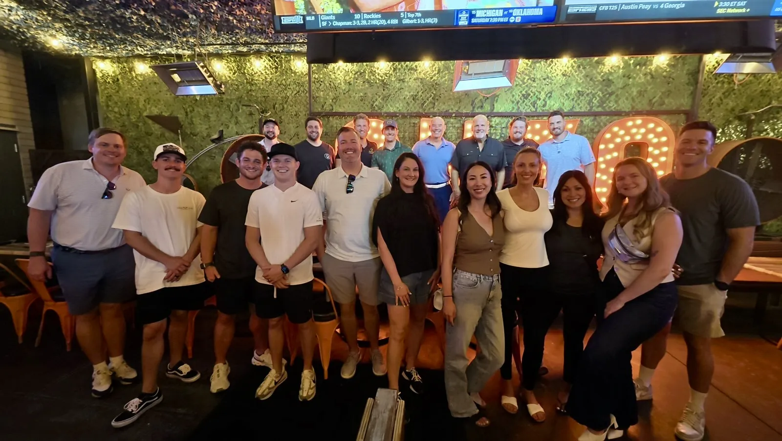 A large group of Ally Waste team members together at a restaurant